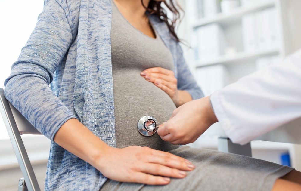 A cropped shot of a doctor examining a pregnant woman